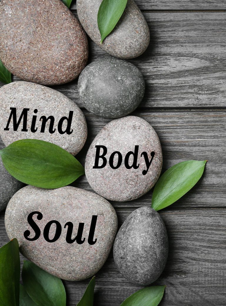 a variety of rocks that show the words, "mind," "body," and "soul."